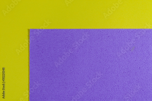 Fotografie Eva foam ethylene vinyl acetate sponge plush light purple surface on lemon yello
