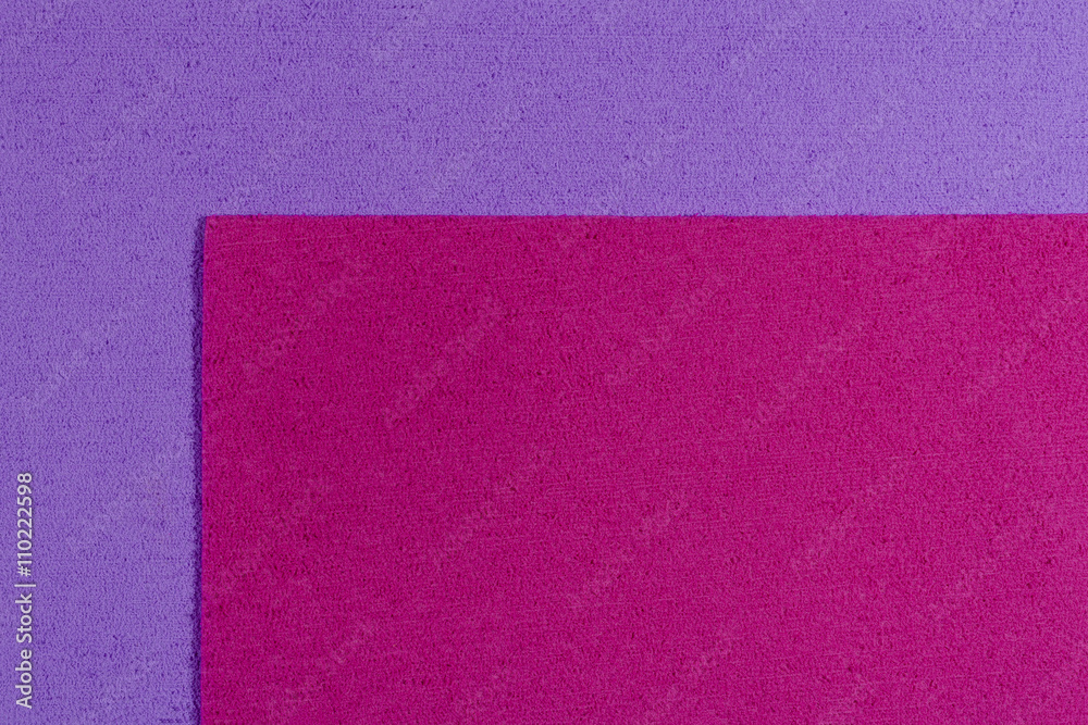 Fototapeta premium Eva foam ethylene vinyl acetate pink surface on light purple sponge plush background