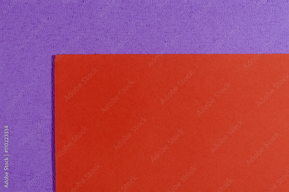 Fototapeta premium Eva foam ethylene vinyl acetate smooth orange surface on light purple sponge plush background