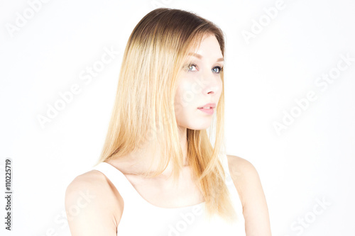 Beautiful blonde with colored hair on a white background. Hairdressing.