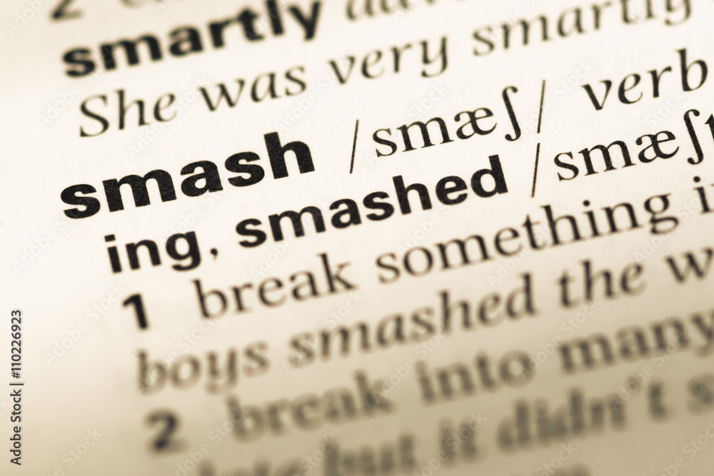 Close up of old English dictionary page with word smash Close up of old English dictionary page with word smash