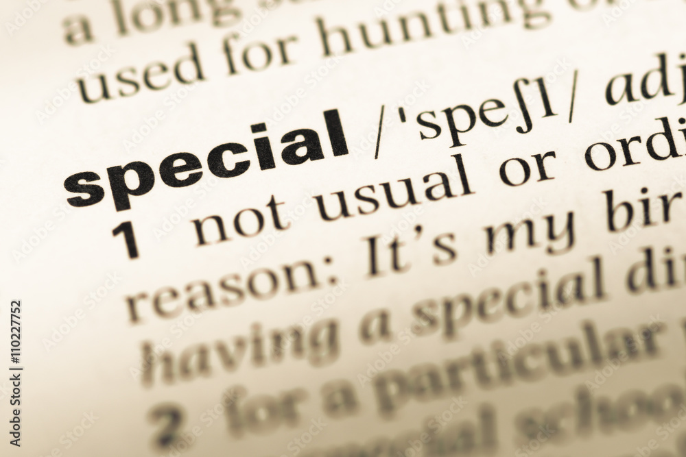 Close up of old English dictionary page with word special Close up of old English dictionary page with word special