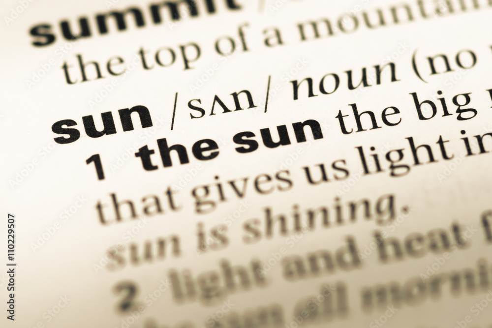 Close up of old English dictionary page with word sun Close up of old English dictionary page with word sun