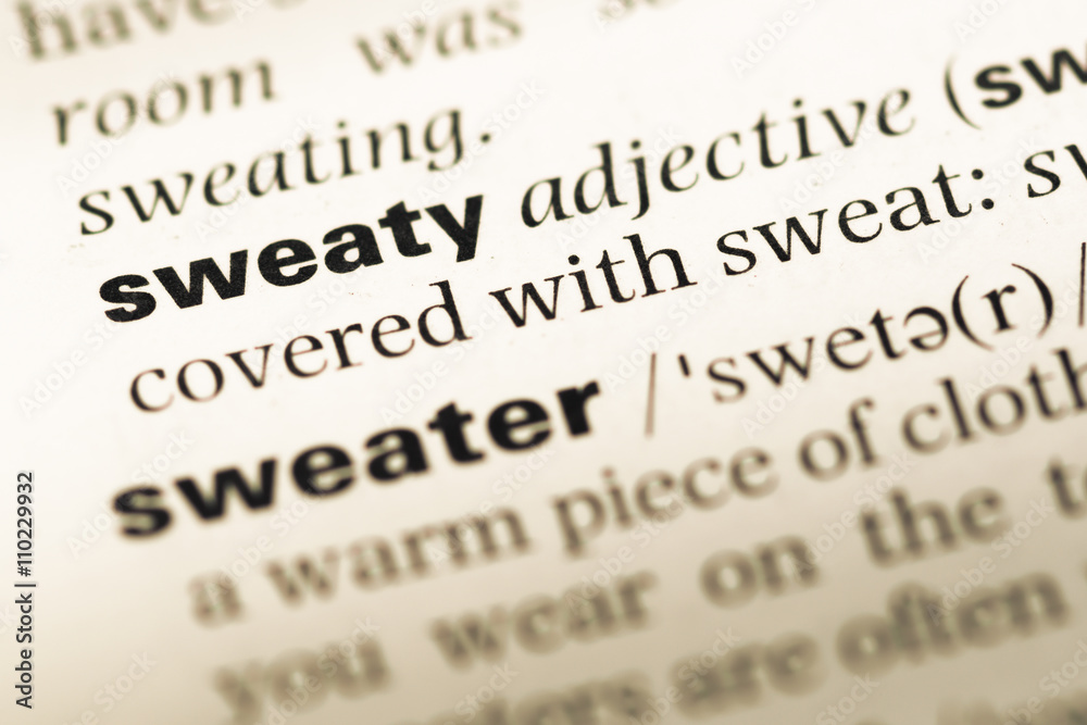 Close up of old English dictionary page with word sweaty Close up of old English dictionary page with word sweaty