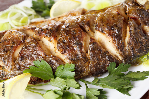 Roasted carp fish with vege...