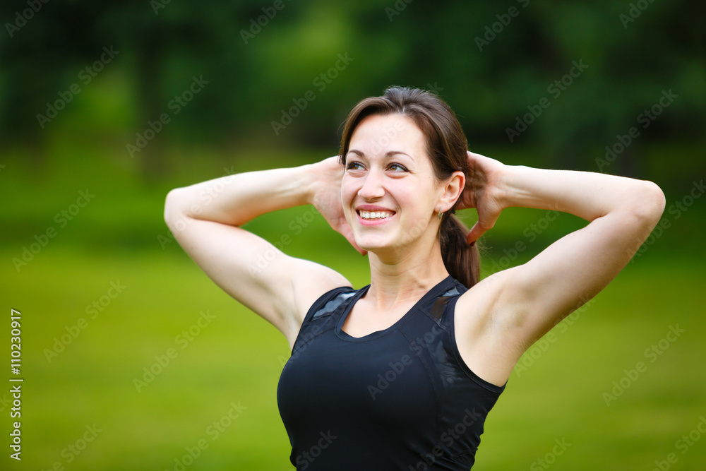 Athletic woman warming up in a park before Runner outdoor on summer, healthy lifestyle concept
