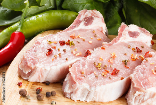 Raw steak with vegetables, ...
