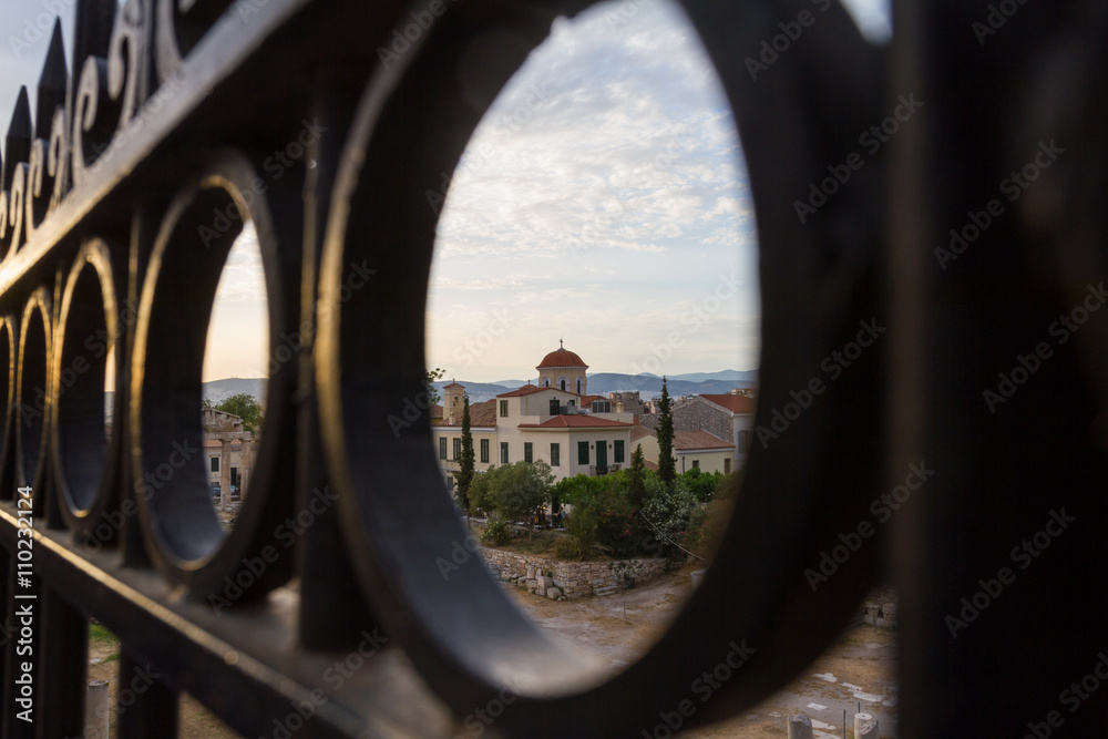 View through gate of Church behind Roman Agora in Athens, Greece