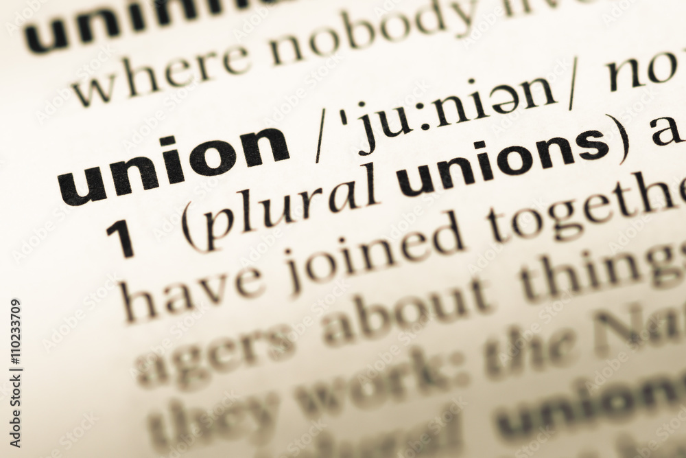 Obraz premium Close up of old English dictionary page with word union