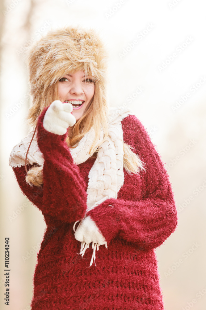 Portrait of pretty smiling woman in fur winter hat Portrait of pretty smiling woman in fur winter hat