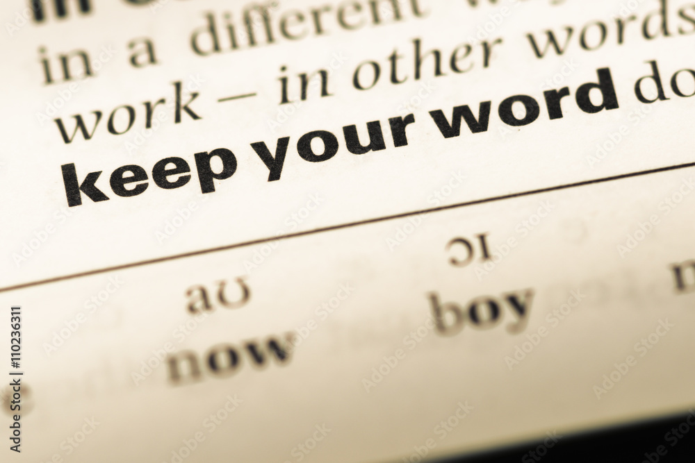 Close up of old English dictionary page with word keep your word Close up of old English dictionary page with word keep your word