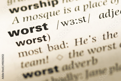 Close up of old English dictionary page with word worst