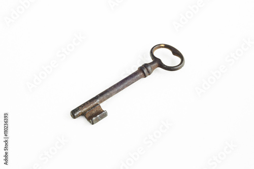 Old iron key on a white background