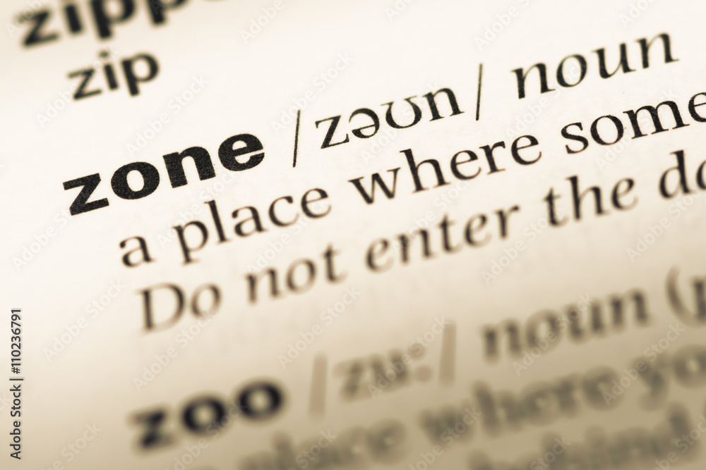 Close up of old English dictionary page with word zone Close up of old English dictionary page with word zone