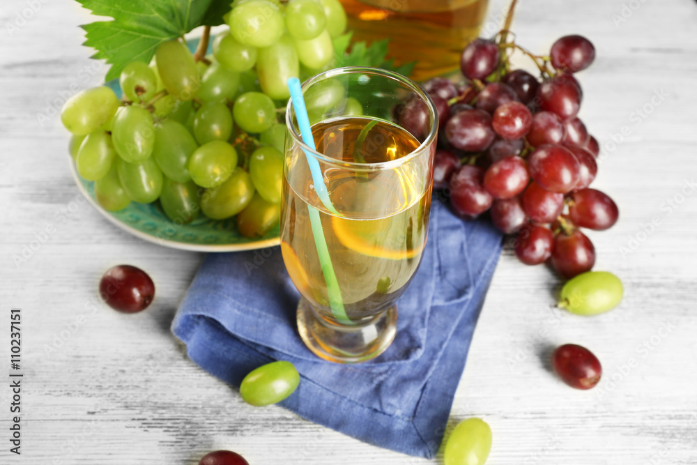 Glass with grape juice on blue napkin Glass with grape juice on blue napkin