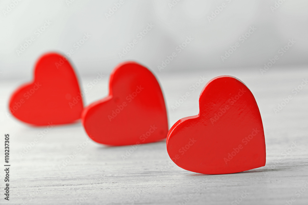 Wooden hearts on light background Wooden hearts on light background