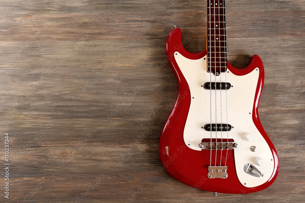 Fototapeta premium Electric guitar on wooden background