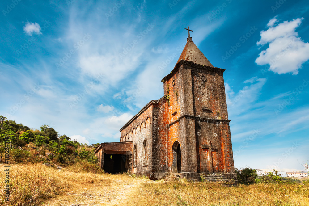 Fototapeta premium Abandoned christian church on top of Bokor mountain in Preah Monivong national park, Kampot, Cambodia