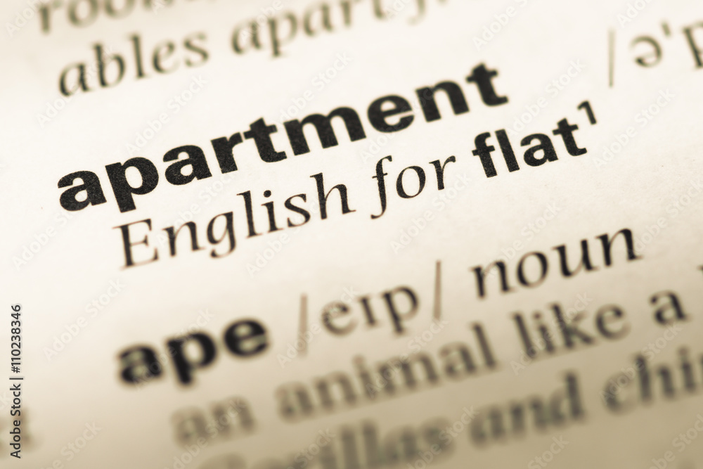 Close up of old English dictionary page with word apartment Close up of old English dictionary page with word apartment
