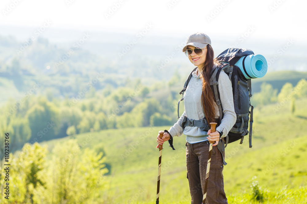 Hiker backpacker girl enjoing journey in mountains