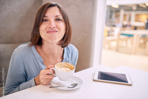 woman pulling her face with funny expression at camera