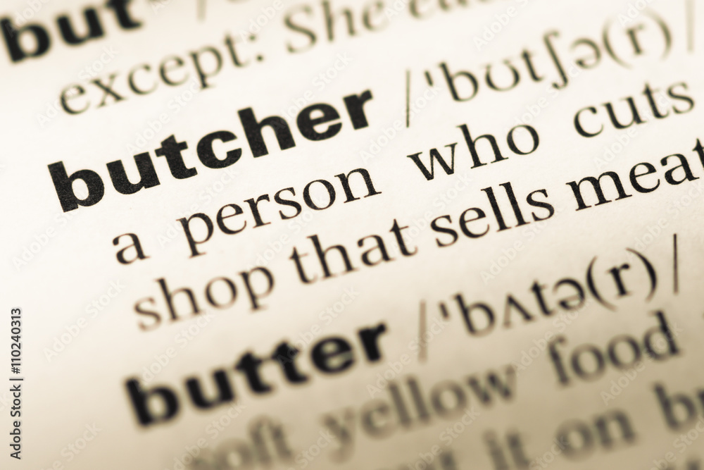 Close up of old English dictionary page with word butcher Close up of old English dictionary page with word butcher
