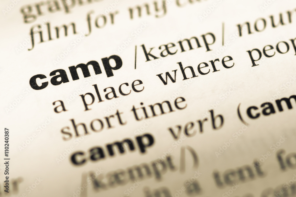 Obraz premium Close up of old English dictionary page with word camp