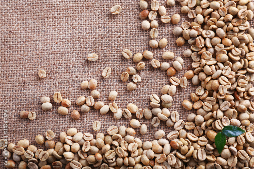 Green coffee beans on sackcloth Green coffee beans on sackcloth