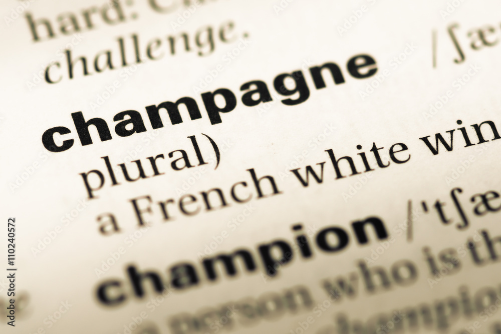 Close up of old English dictionary page with word champagne Close up of old English dictionary page with word champagne