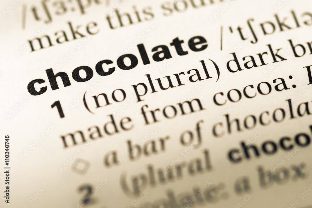 Close up of old English dictionary page with word chocolate Close up of old English dictionary page with word chocolate