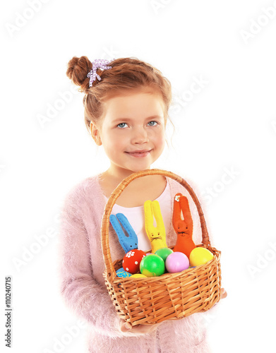 Little girl holding wicker ...