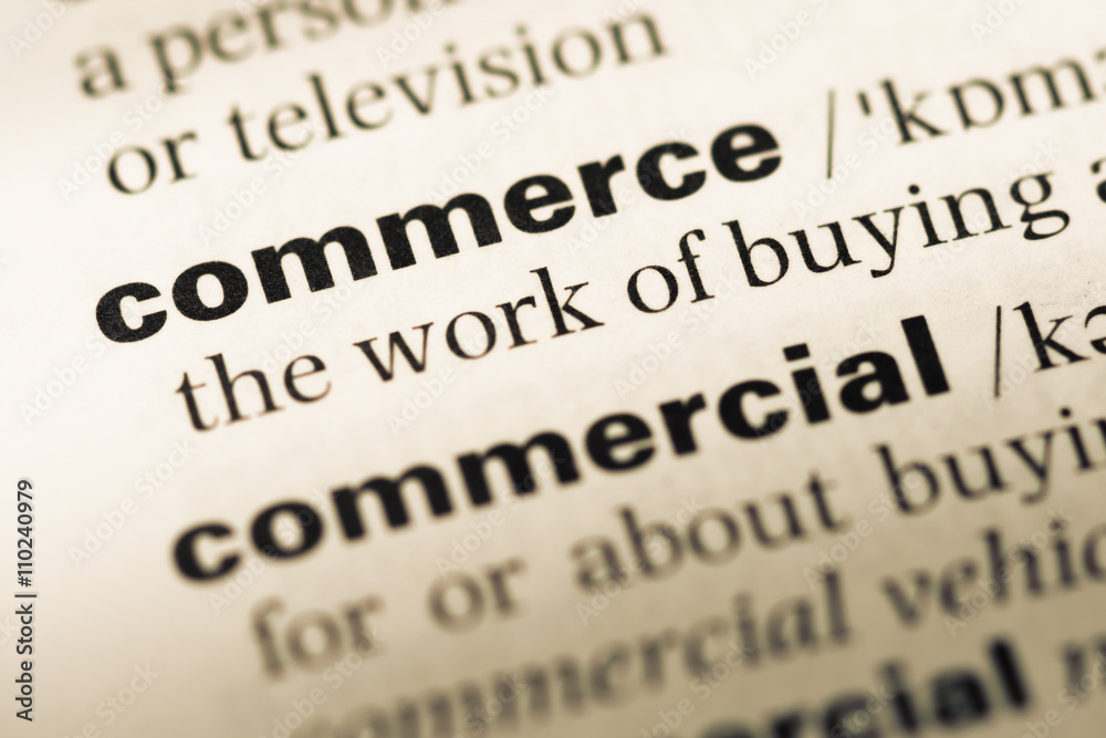 Close up of old English dictionary page with word commerce Close up of old English dictionary page with word commerce