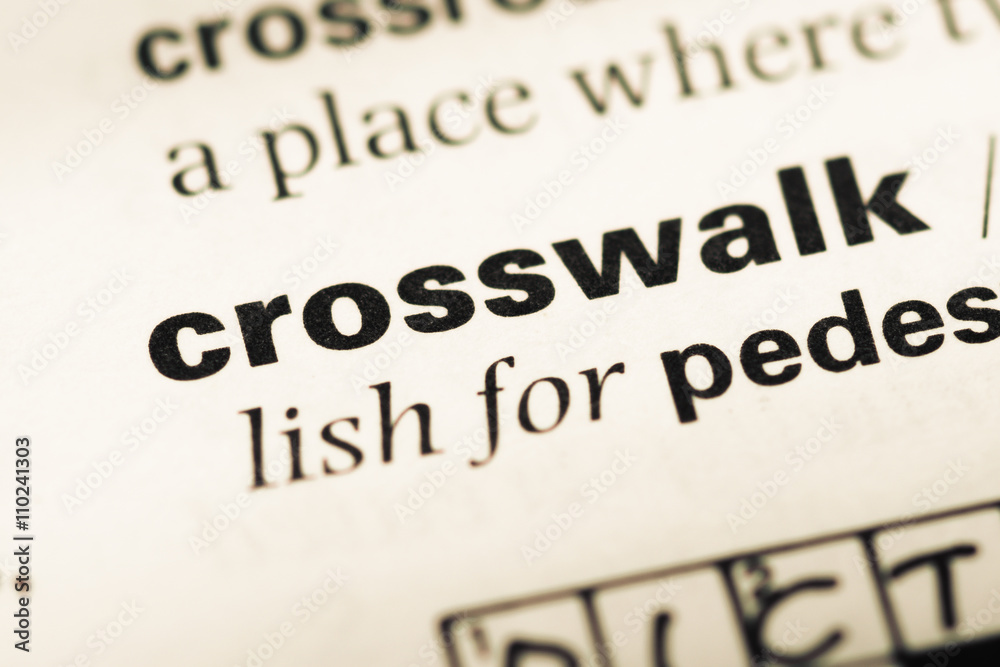 Close up of old English dictionary page with word crosswalk Close up of old English dictionary page with word crosswalk