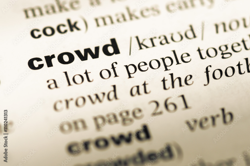 Close up of old English dictionary page with word crowd Close up of old English dictionary page with word crowd