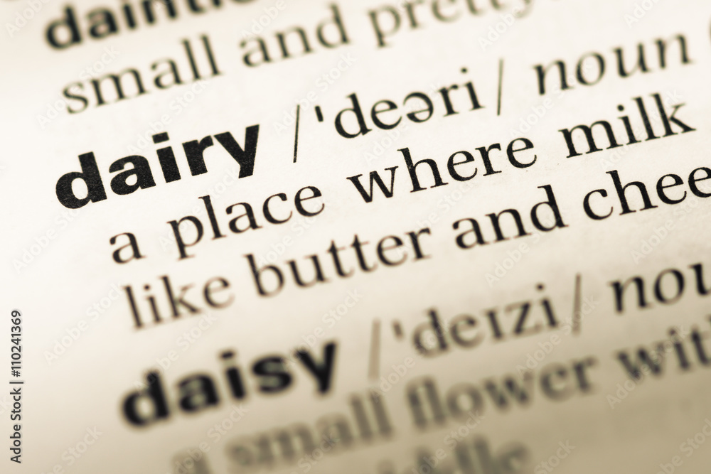 Close up of old English dictionary page with word dairy Close up of old English dictionary page with word dairy