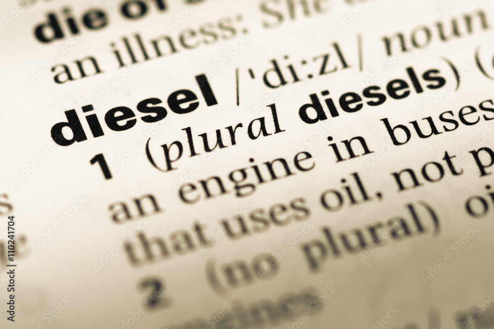 Obraz premium Close up of old English dictionary page with word diesel