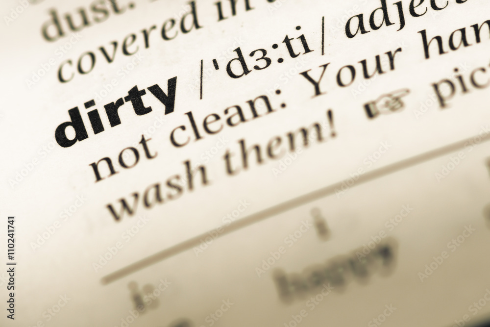 Close up of old English dictionary page with word dirty Close up of old English dictionary page with word dirty