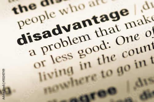 Close up of old English dictionary page with word disadvantage