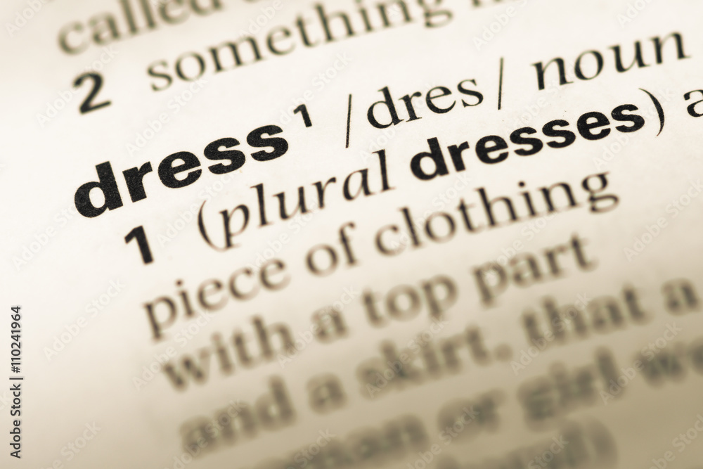 Close up of old English dictionary page with word dress Close up of old English dictionary page with word dress