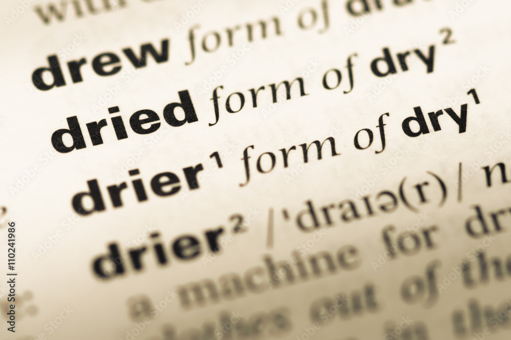 Close up of old English dictionary page with word dried Close up of old English dictionary page with word dried