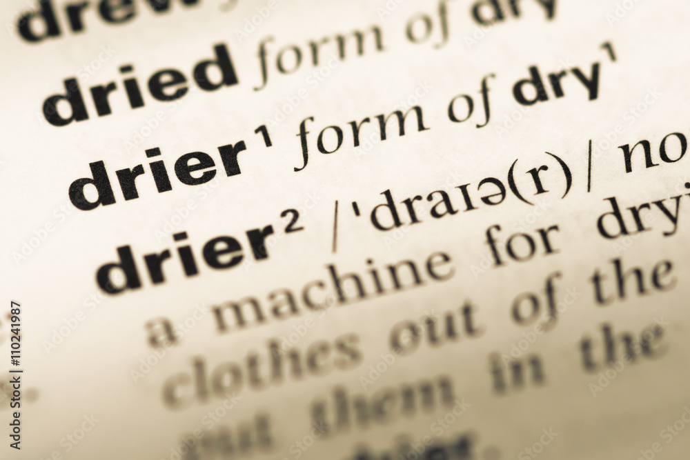 Close up of old English dictionary page with word drier Close up of old English dictionary page with word drier