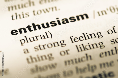 Close up of old English dictionary page with word enthusiasm