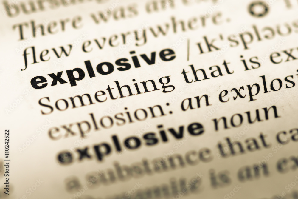 Close up of old English dictionary page with word explosive Close up of old English dictionary page with word explosive