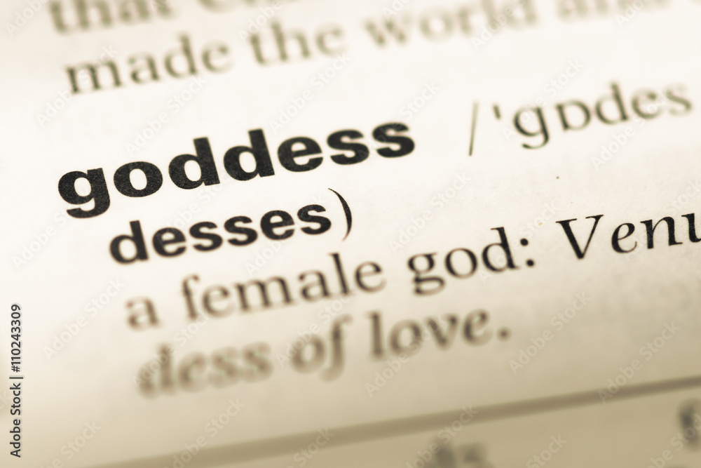Close up of old English dictionary page with word goddess Close up of old English dictionary page with word goddess