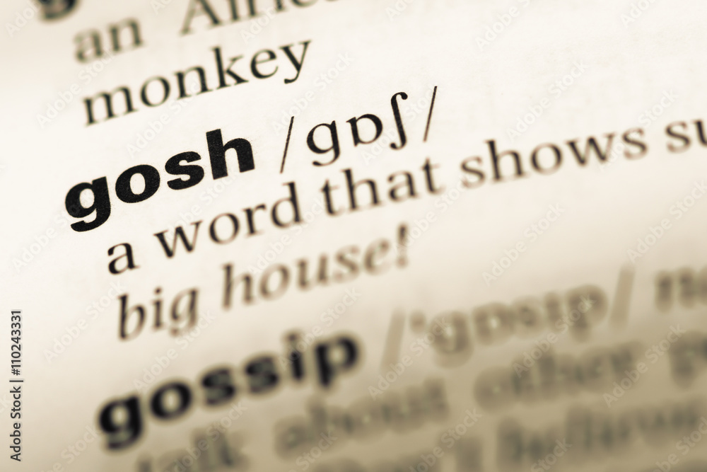 Close up of old English dictionary page with word gosh Close up of old English dictionary page with word gosh