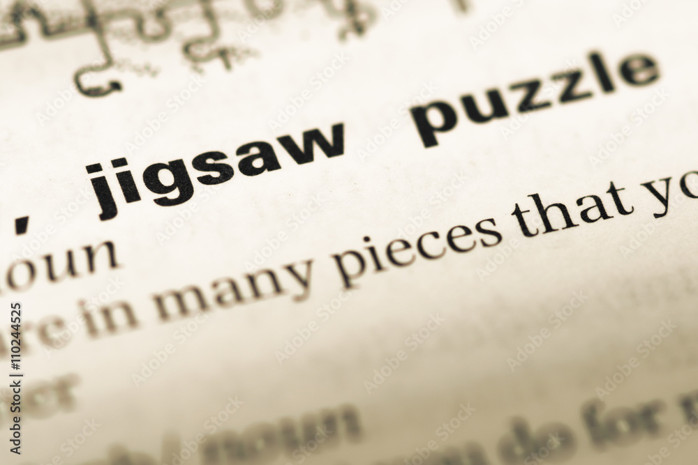 Close up of old English dictionary page with word jigsaw puzzle Close up of old English dictionary page with word jigsaw puzzle