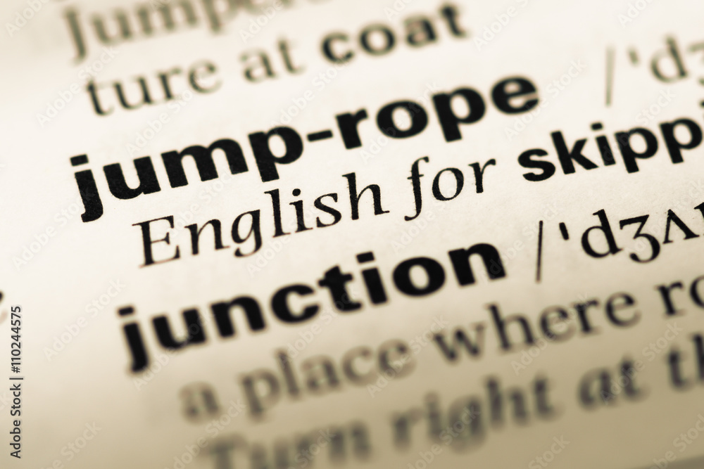 Close up of old English dictionary page with word jump rope Close up of old English dictionary page with word jump rope