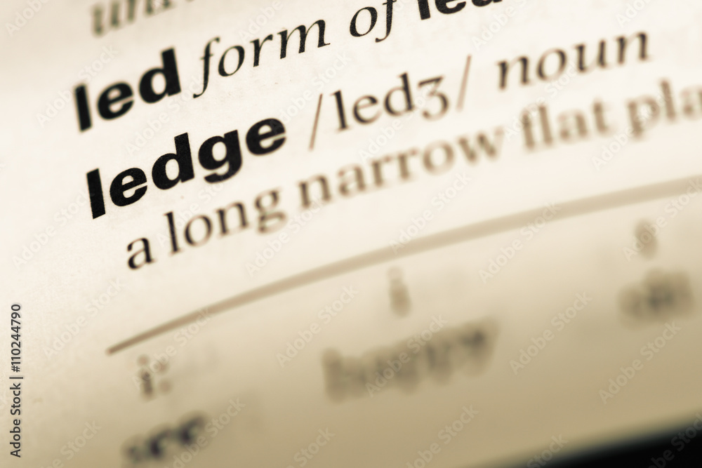 Close up of old English dictionary page with word ledge Close up of old English dictionary page with word ledge