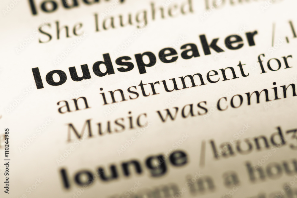 Obraz premium Close up of old English dictionary page with word loudspeaker