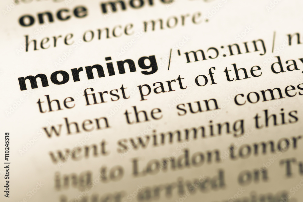 Close up of old English dictionary page with word morning Close up of old English dictionary page with word morning